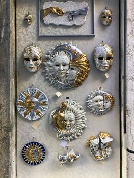 Venetian carnival masks in the wall of a shop in Venice, Veneto, Italy. High quality photo
