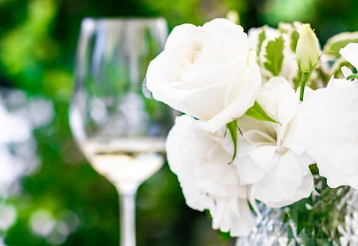 Wedding decoration, table decor and floral beauty, bouquet of white roses in luxury restaurant, beautiful flowers from summer garden.