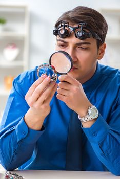 Jeweler working with luxury jewelry in the workshop