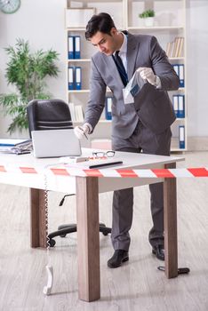 Forensics investigator at the scene of office crime