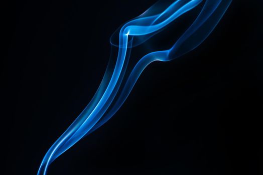 Blue smoke isolated on black background.