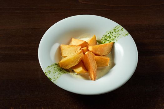 Potatoes in a bowl. Roasted potatoes prepared at the local restaurant