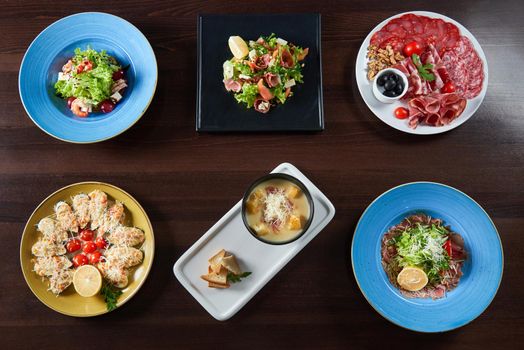 Eatable perfection. Top view of a variety of tasty dishes served at the restaurant