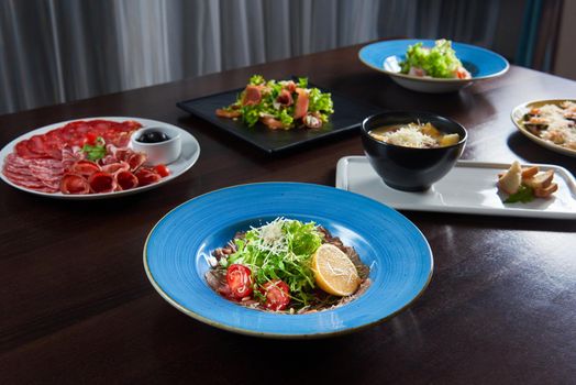 Culinary art. Shot of a restaurant table with delicious foods served