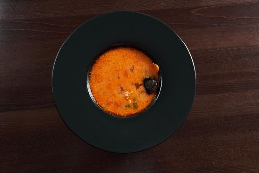 Tomato love. Top view of a bowl of delicious cold tomato gazpacho soup served at the restaurant