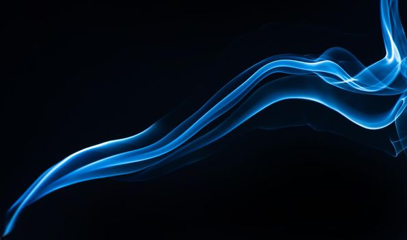 Blue smoke isolated on black background.