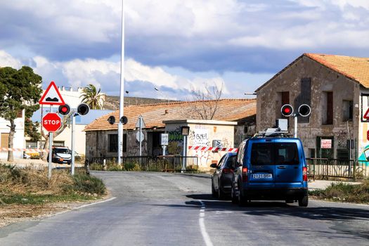 Torrellano, Alicante, Spain- July 3, 2021: Signposted level crossing in Torrellano a small village of Alicante, next to the airport in summer.