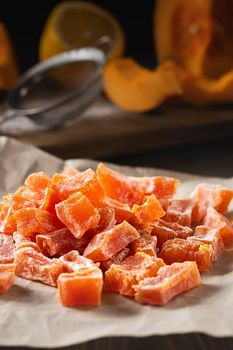 Cooking Natural farm homemade candied pumpkin fruits sprinkled with powdered sugar.