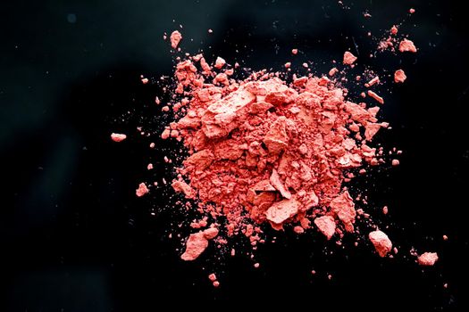 Crushed cosmetics, mineral organic eyeshadow, blush and cosmetic powder isolated on black background, makeup and beauty banner, flatlay design.