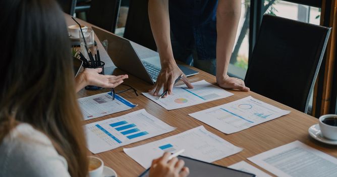 Business People Meeting to discuss and brainstorming the financial report paperwork in home office. Financial advisor teamwork and accounting concept.