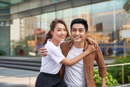 Young happy couple with shopping bags in the city,having fun together