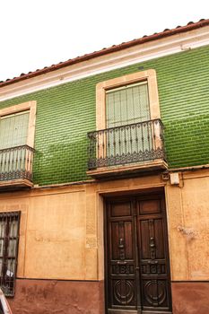 Colorful and majestic old house facade in Villanueva de los Infantes, Spain in a sunny day of Spring