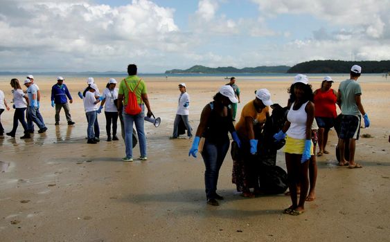 salvador, bahia, brazil - june 5, 2015: social action with volunteers cleaning the beach of Sao Tome de Paripe in the city of Salvador.