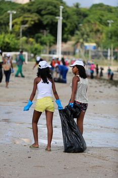 salvador, bahia, brazil - june 5, 2015: social action with volunteers cleaning the beach of Sao Tome de Paripe in the city of Salvador.