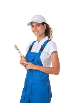 Beautiful young woman house painter with paintbrush isolated on white background