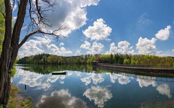 Panoramic image of Neye reservoir with clouds at springtime, Wipperfurth, Bergisches Land, Germany