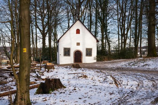 Old chapel on the long distance hiking trail Bergischer Panoramasteig close to Lindlar on a winter day, Germany