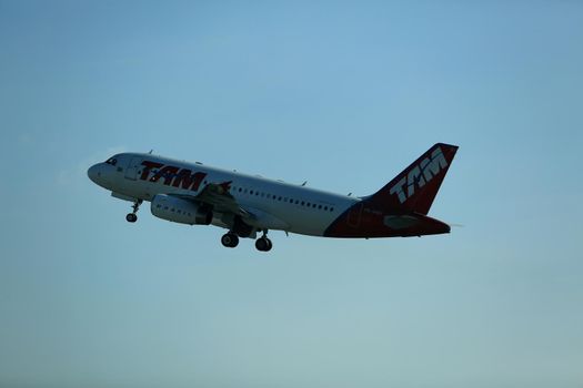salvador, bahia, brazil - february 11, 2017: Airbus aircraft of Tam Linhas Aareas is seen during approach for landing at Salvador City Airport.