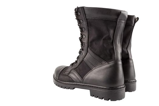 a pair of one new black lightweight military boots isolated on white background, standing vertically, view from back.
