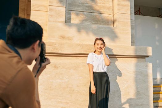 summer holidays and dating concept - couple taking photo picture in the city 