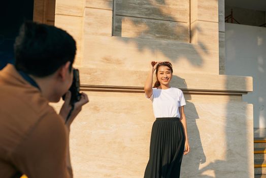 summer holidays and dating concept - couple taking photo picture in the city 