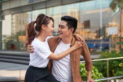 Young happy couple with shopping bags in the city,having fun together