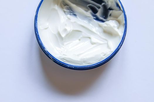 Cosmetic cream white texture in plastic container