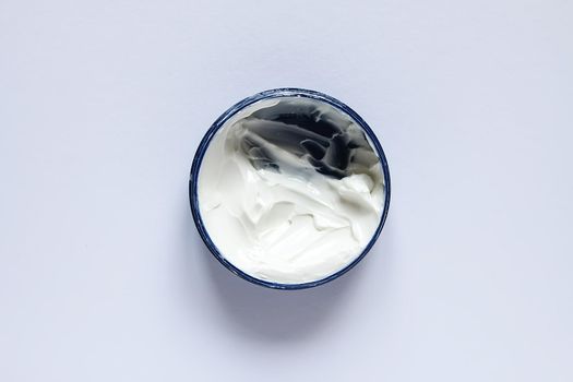 Cosmetic cream white texture in plastic container