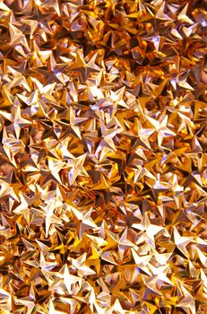 Golden confetti stars festive bright background or Christmas or New Year party decoration