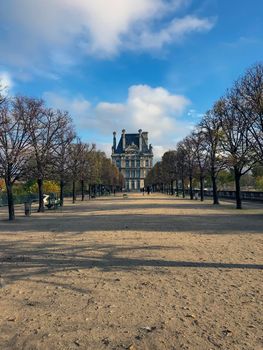 Avenue of trees in autumn leading to the Musee du Louvre in Paris France. High quality photo