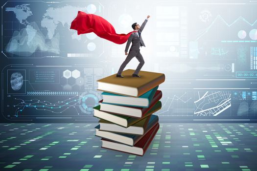 Superhero businessman  in education concept with books