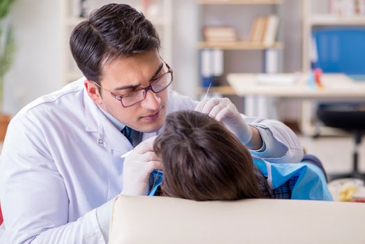 Patient visiting dentist for regular check-up and filling