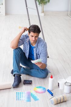 Young man overspending his budget in refurbishment project