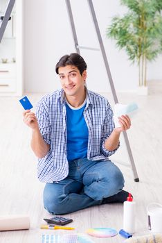 Young man overspending his budget in refurbishment project