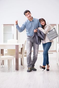 Married couple in the shop choosing furniture