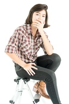 Young pretty woman in plaid shirt posing in studio with isolated on white background