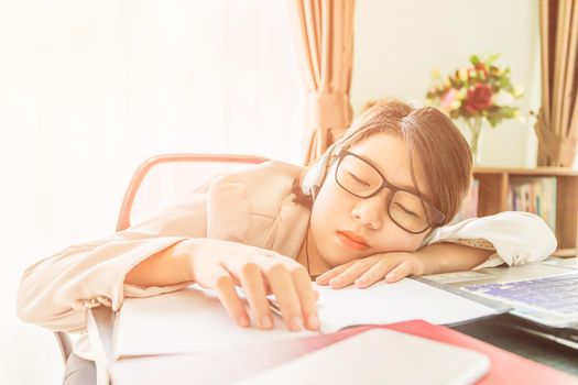 Teenage girl short hair relaxed after working on laptop while sit near window at home office