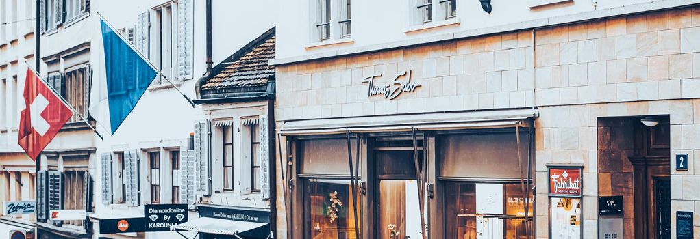 Zurich, Switzerland circa June 2021: Cinematic view of historic Old Town, shops and luxury stores near main downtown Bahnhofstrasse street, Swiss architecture and travel destination