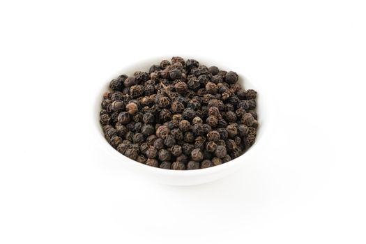 black peppers on white background