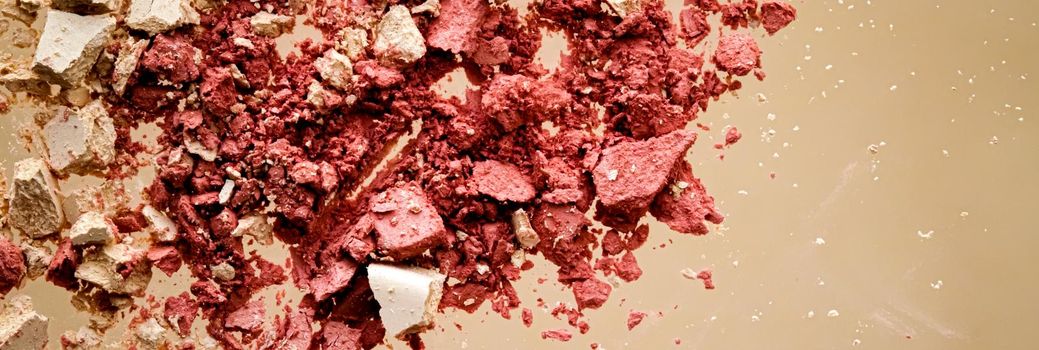 Crushed cosmetics, mineral organic eyeshadow, blush and cosmetic powder isolated on golden background, makeup and beauty banner, flatlay design.