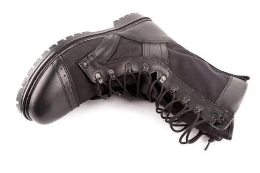 new black summertime lightweight military boot with nylon parts isolated on white background.
