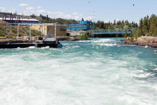 Violent white water in spillway of hydro-electric power plant of the small scale hydro station at Whitehorse, Yukon Territory, Canada