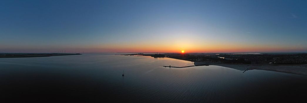 Aerial from the IJsselmeer near Lemmer in the Netherlands at sunset