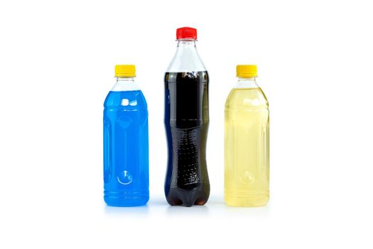 Multi colored drinks in plastic bottles isolated on white background.