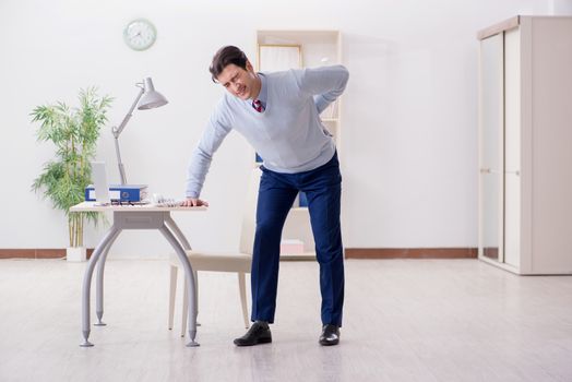 Employee suffering from backpain in office