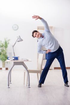 Employee doing stretching exercises in the office