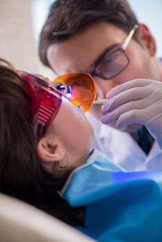 Patient visiting dentist for regular check-up and filling