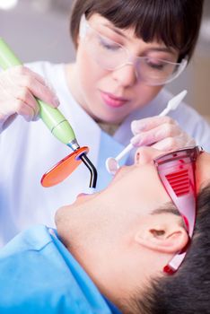 Patient visiting dentist for regular check-up and filling