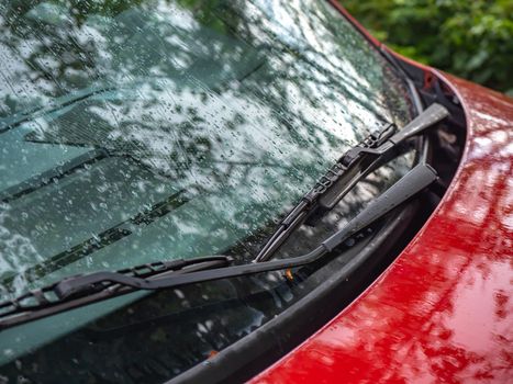 Close up of car windshield wipers in red car