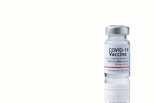 COVID-19 VACCINE ampoule isolated on a white background.